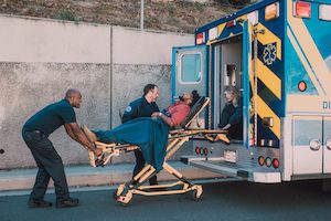 Paramedics helping injured man